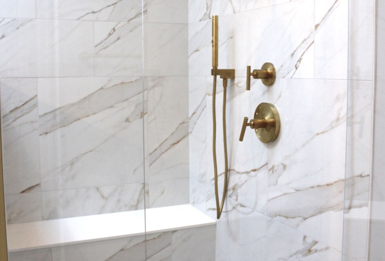Marble waterfall shower with hexagonal tile flooring in Delaware bathroom remodel-1