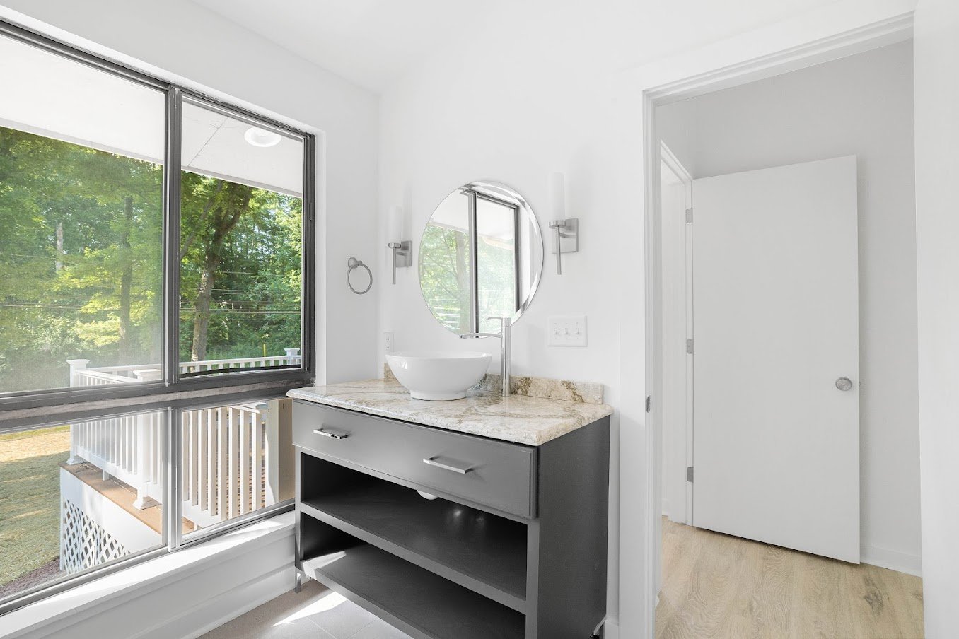 Modern bathroom addition with vessel porcelain bowl sink on vanity