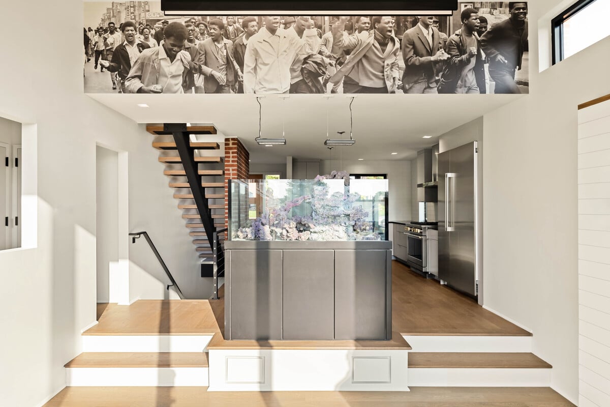 View of steps leading to open-concept kitchen in Delaware custom home