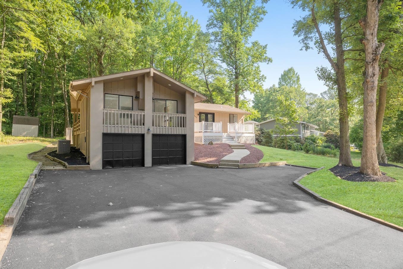 custom two car garage addition with deck above
